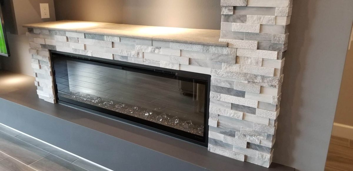 Tile project by PhD Home Solutions — fireplace tile