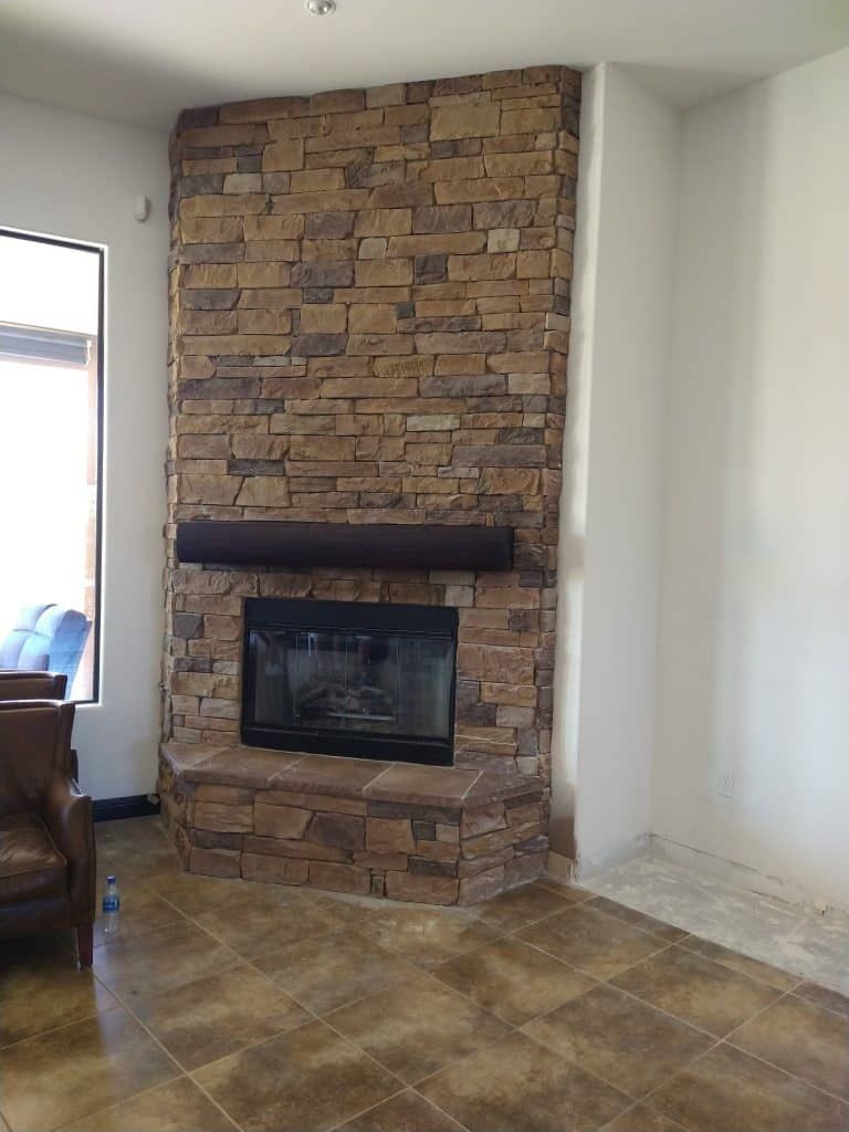 Fireplace before: tan ledger stone